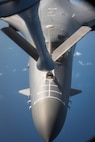 A U.S. Air Force B-1B Lancer assigned to the 9th Expeditionary Bomb Squadron, deployed from Dyess Air Force Base, Texas, flies a 10-hour mission from Andersen Air Force Base, Guam, through the South China Sea, operating with the U.S. Navy's Arleigh Burke-class guided-missile destroyer USS Sterett (DDG 104), June 8, 2017. The joint training, organized under Pacific Command's continuous bomber presence program (CBP), allows the Air Force and Navy to increase interoperability by refining joint tactics, techniques and procedures while simultaneously strengthening their ability to seamlessly integrate their operations. (U.S. Air Force photo/Staff Sgt. Joshua Smoot)