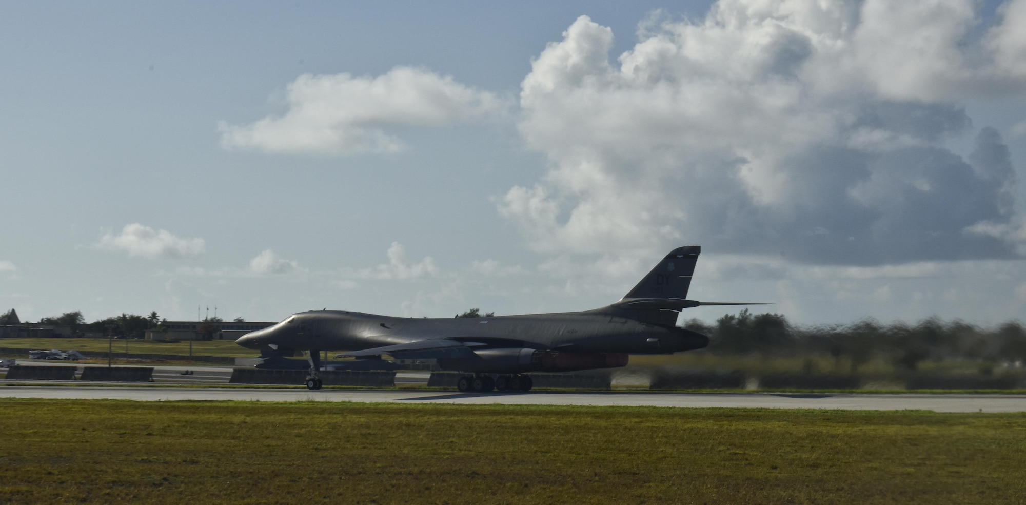 A U.S. Air Force B-1B Lancer assigned to the 9th Expeditionary Bomb Squadron, deployed from Dyess Air Force Base, Texas, takes off from Andersen Air Force Base, Guam, for a 10-hour mission through the South China Sea, operating with the U.S. Navy's Arleigh Burke-class guided-missile destroyer USS Sterett (DDG 104), June 8, 2017. The joint training, organized under U.S. Pacific Command's continuous bomber presence (CBP), allows the Air Force and Navy to increase interoperability by refining joint tactics, techniques and procedures while simultaneously strengthening the ability to seamlessly integrate operations. (U.S. Air Force photo/Tech. Sgt. Richard P. Ebensberger)