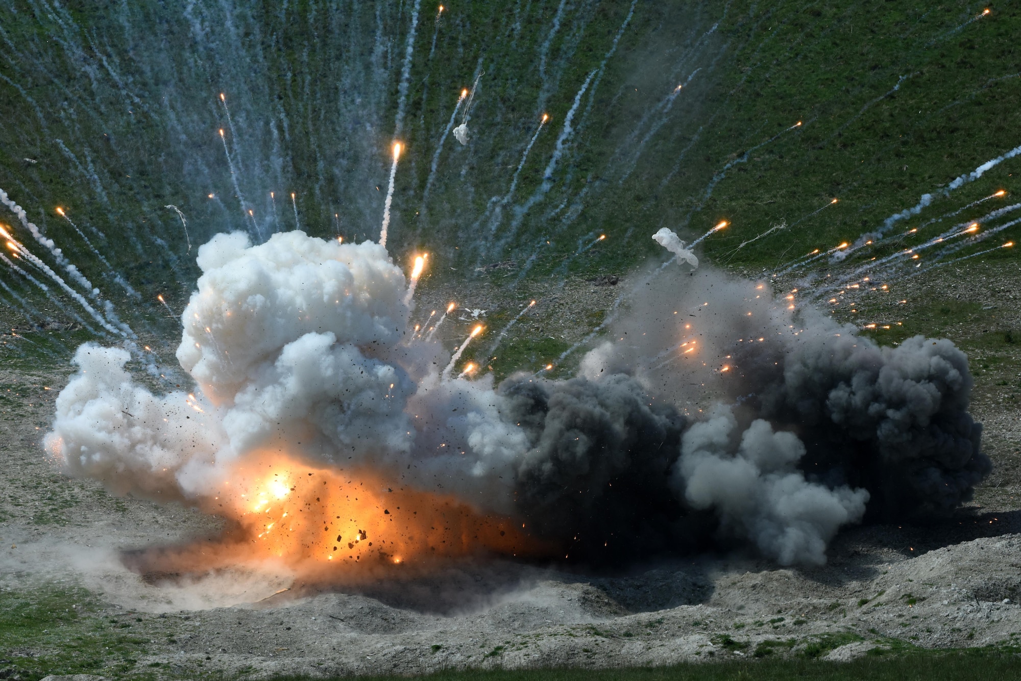 Expired ammunition is disposed of during a controlled detonation at Salisbury Plain Training Area, Wiltshire, England, May 24. Explosive ordnance disposal technicians assigned to the 48th Civil Engineer Squadron partnered with the British Army’s 11 EOD Regiment in order to gain access to the range. (U.S. Air Force photo/Airman 1st Class Eli Chevalier)
