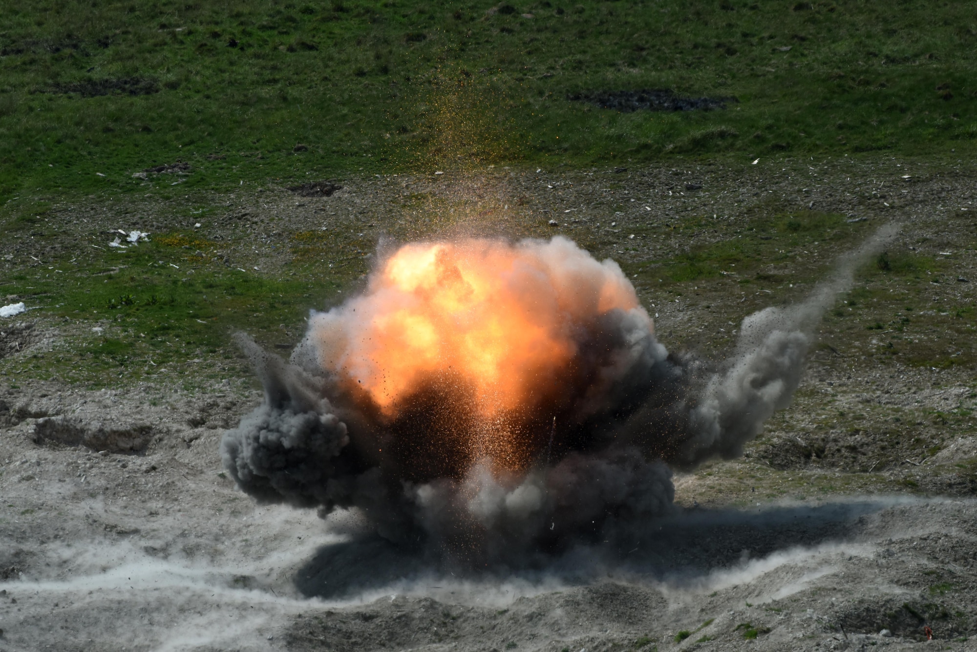 Expired ammunition is disposed of during a controlled detonation at Salisbury Plain Training Area, Wiltshire, England, May 24. Explosive ordnance disposal technicians assigned to the 48th Civil Engineer Squadron partnered with the British Army’s 11 EOD Regiment in order to gain access to the range. (U.S. Air Force photo/Airman 1st Class Eli Chevalier)