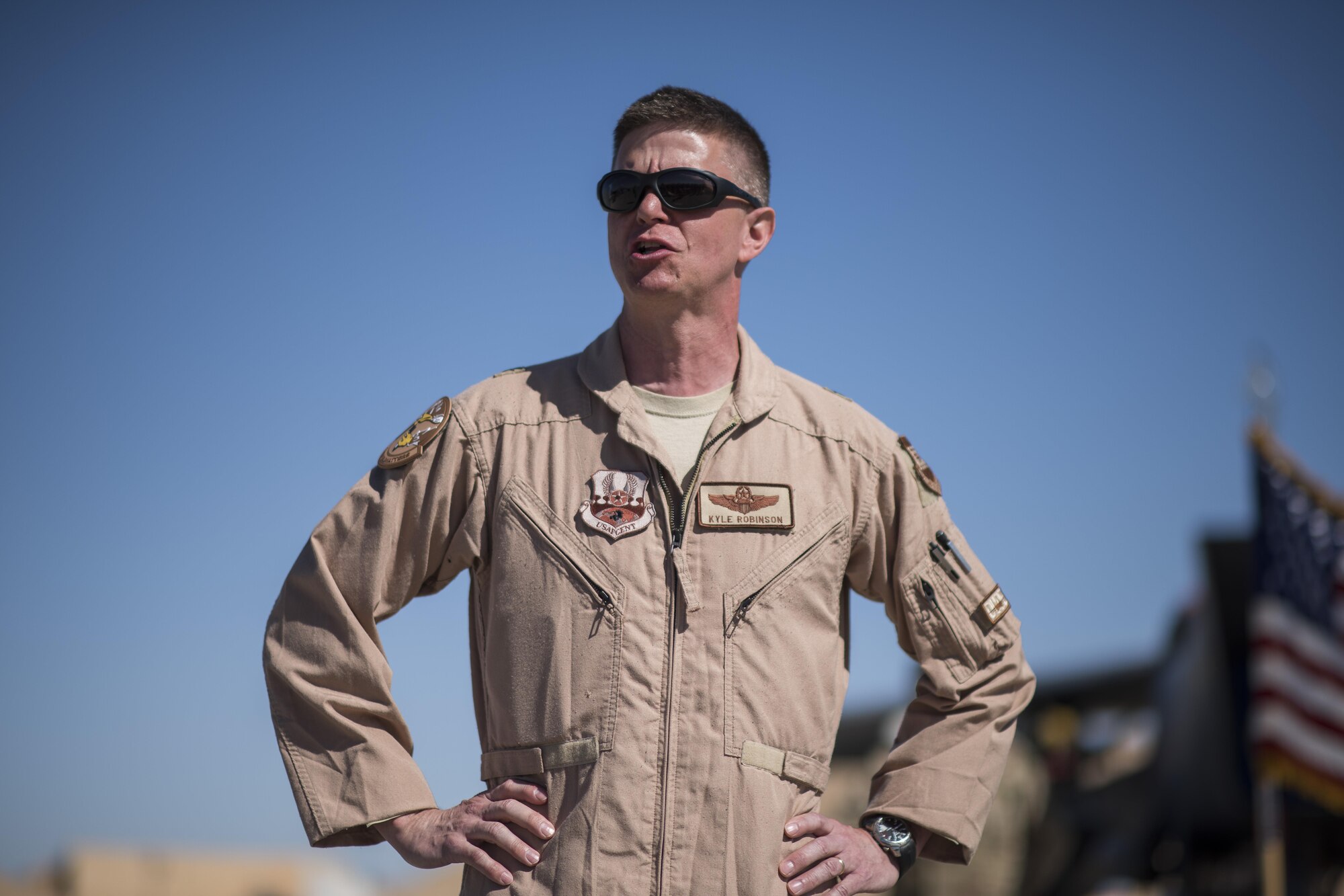Brig. Gen. Kyle W. Robinson, 332nd Air Expeditionary Wing commander, talks to the audience during the 332nd Expeditionary Operations Group change of command ceremony June 7, 2017, in Southwest Asia. Robinson presided over the ceremony in which Col. William L. Marshall took command of the group from Col. Thomas Palmer. (U.S. Air Force photo/Senior Airman Damon Kasberg)