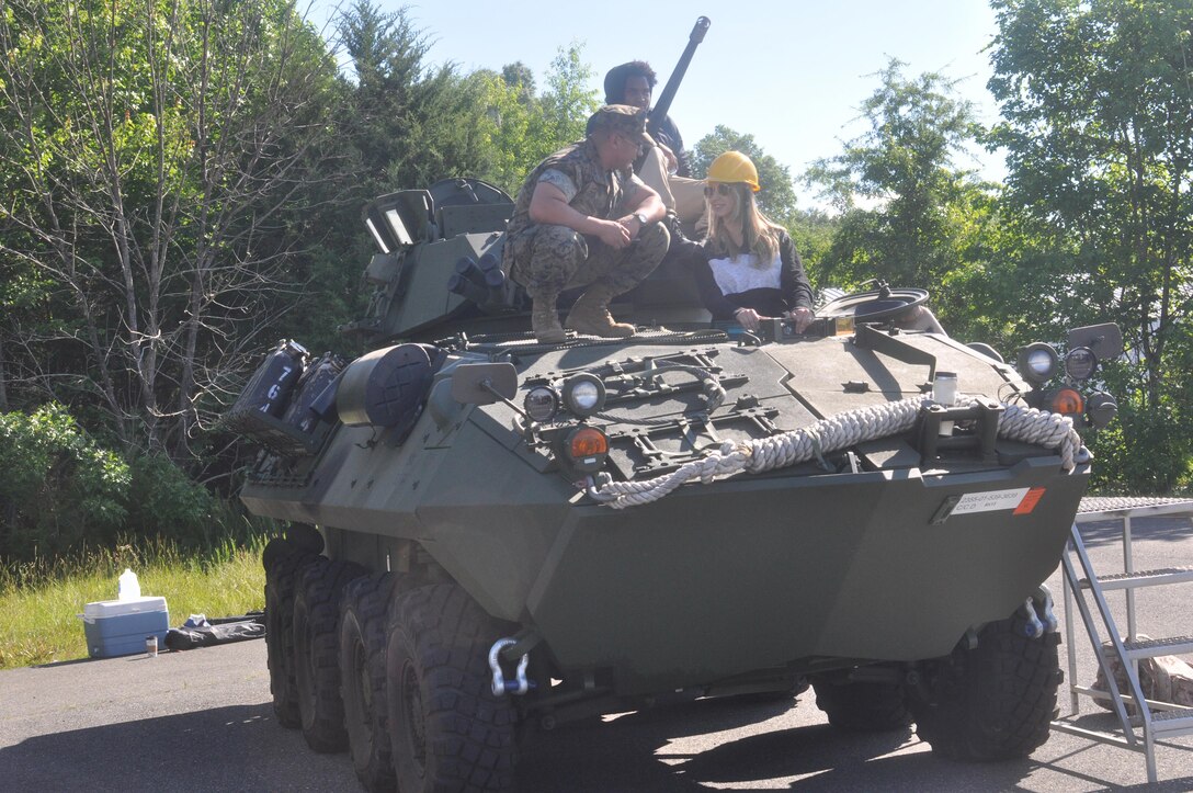 Sgt. Hugo Guayara II with his spouse Barbra Kopecky in an LAV-25.