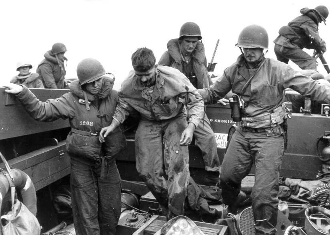 Wounded US Marines moved by the US Coast Guard sailors on landing craft on Iwo Jima
WWII

Working uniform