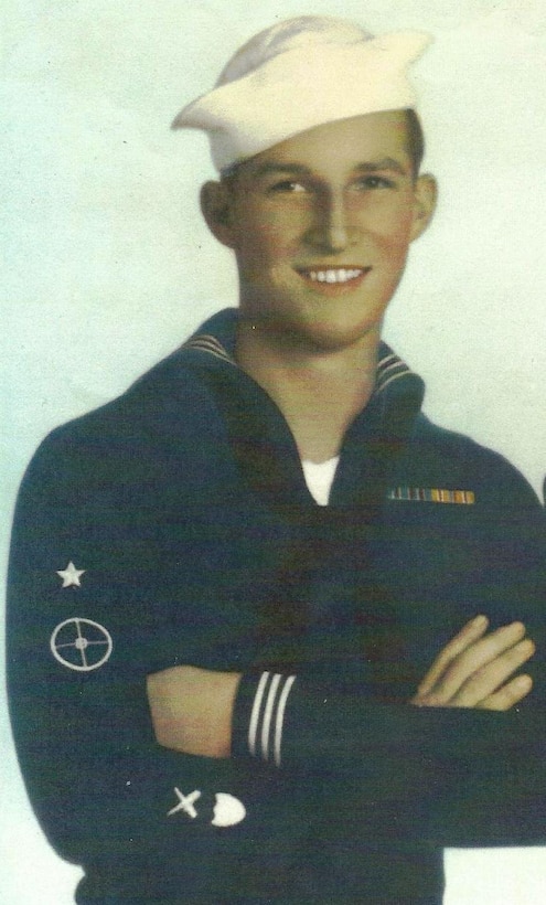 GM3 Neil Blumenstein, USCGR
WWII

Dress blues with white "Dixie Cup" hat; this was a typical uniform combination worn while on liberty.  This uniform was the same as worn by Navy sailors except for the shield device, in white, on the lower right sleeve.  Note the Gun Pointer First Class insignia.

