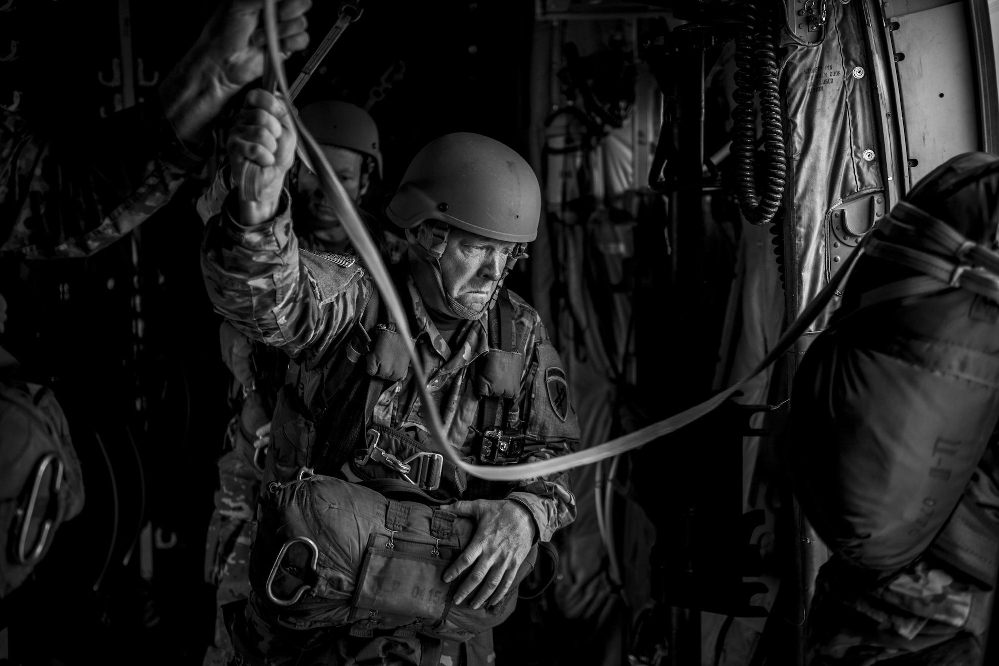 U.S. and German military members jump out of a U.S. Air Force C-130J Super Hercules assigned to the 37th Airlift Squadron at Ramstein Air Base, Germany, over Sainte-Mere-Eglise, France, June 4, 2017. The jumps were performed using static lines. A static line is a fixed cord attached to the aircraft at one end and a deployment bag at the other. When the paratrooper jumps out of the aircraft, the line tightens which then pulls the deployment bag out of the container on the paratrooper’s back revealing the parachute. This event commemorates the 73rd anniversary of D-Day, the largest multinational amphibious landing and operational military airdrop in history, and highlights the U.S.' steadfast commitment to European allies and partners. Overall, approximately 400 U.S. service members from units in Europe and the U.S. are participating in ceremonial D-Day 73 events from May 31-June 7, 2017. (U.S. Air Force photo by Senior Airman Devin Boyer)