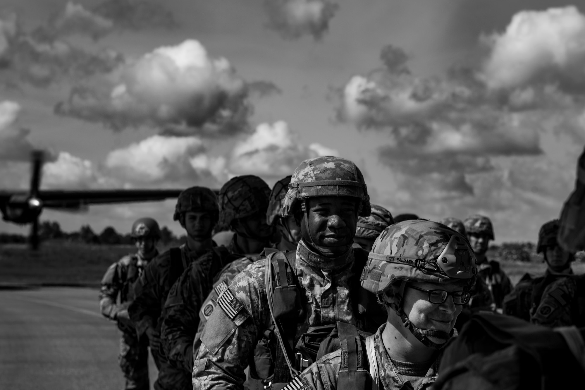 U.S. and German military members board a U.S. Air Force C-130J Super Hercules assigned to the 37th Airlift Squadron at Ramstein Air Base, Germany, at Cherbourg-Maupertus Airport, France, June 4, 2017. The modern-day paratroopers recreated air drops similar to the ones on D-Day, June 6, 1944. This event commemorates the 73rd anniversary of D-Day, the largest multinational amphibious landing and operational military airdrop in history, and highlights the U.S.' steadfast commitment to European allies and partners. Overall, approximately 400 U.S. service members from units in Europe and the U.S. are participating in ceremonial D-Day 73 events from May 31-June 7, 2017. (U.S. Air Force photo by Senior Airman Devin Boyer)