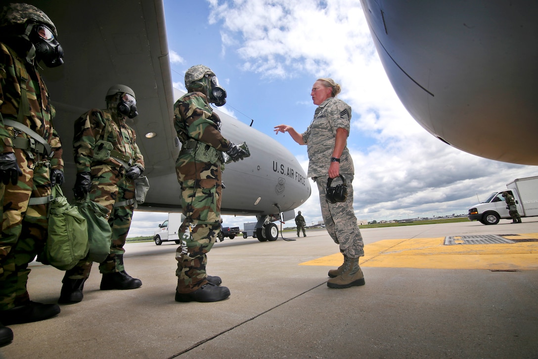 New Jersey Air National Guardsmen Chief Master Sgt. Michele Evans, right, briefs guardsmen on aircraft decontamination procedures before an exercise at Joint Base McGuire-Dix-Lakehurst, N.J., June 7, 2017. The airmen are assigned to the 108th Wing. Air National Guard photo by Master Sgt. Matt Hecht