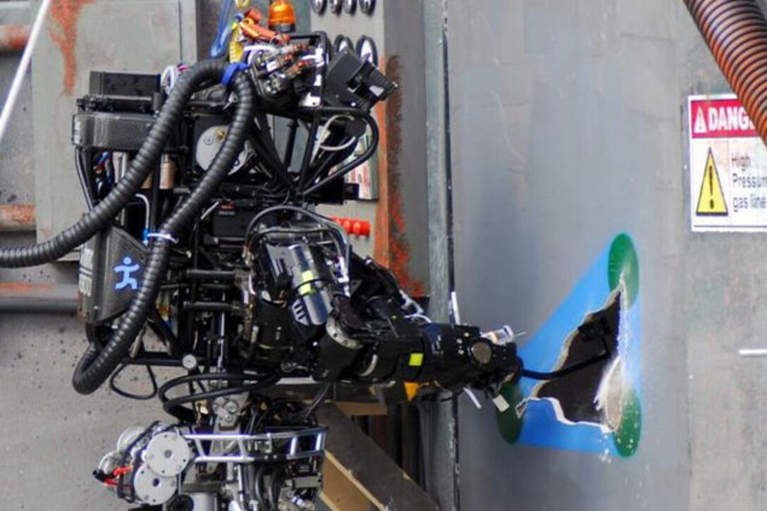An Atlas robot is hard at work during the second round of DARPA's Robotics Challenge in 2013. Courtesy photo by DRC-DARPA
