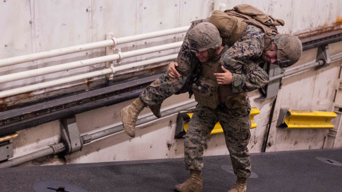 Marines with Echo Company, Battalion Landing Team, 2nd Battalion, 5th Marine Regiment, practice fireman carrying during a Combat Life Saver class aboard the USS Green Bay (LPD 20), at sea, Mar. 31, 2017. The Marines are currently on patrol as the Ground Combat Element for the 31st MEU. As the Marine Corps' only continuously forward-deployed unit, the 31st Marine Expeditionary Unit's air-ground-logistics team provides a flexible force, ready to perform a wide range of military operations, from limited combat to humanitarian assistance operations, throughout the Indo-Asia-Pacific region. 