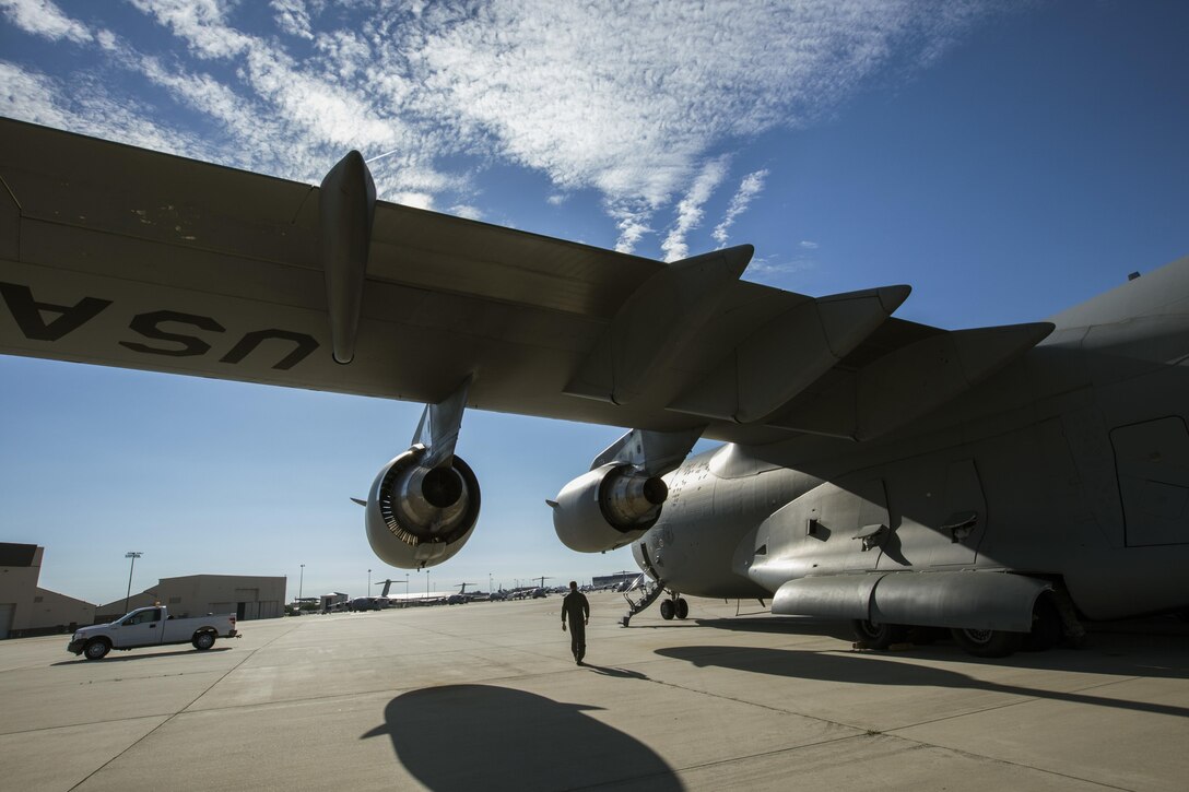 A U.S. Air Force Loadmaster with the 732nd Airlift Squadron, 514th Air Mobility Wing, walks toward a U.S. Air Force C-17 Globemaster III during a joint mobility exercise with the 35th Aerial Port Squadron, 514th Air Mobility Wing, and the 851st Transportation Detachment, U.S. Army Reserve, at Joint Base McGuire-Dix-Lakehurst, N.J., June 4, 2017. The C-17 is assigned to the 305th Air Mobility Wing and is maintained and flown by the 514th Air Mobility Wing, Air Force Reserve Command. (U.S. Air Force photo by Master Sgt. Mark C. Olsen/Released)