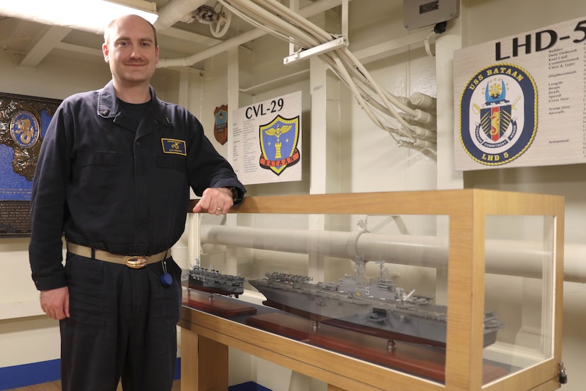 170429-N-OX321-010
U.S. 5TH FLEET AREA OF OPERATIONS (April 29, 2017) Assistant Intelligence Officer Lt. j. g. Britt Zerbe poses for a photo in the Jose Calugas museum aboard the amphibious assault ship USS Bataan (LHD 5). Bataan and its ready group are deployed in the U.S. 5th Fleet area of operations in support of maritime security operations designed to reassure allies and partners, and preserve the freedom of navigation and the free flow of commerce in the region. (U.S. Navy photo by Mass Communication Specialist 1st Class Kegan E. Kay/Released)