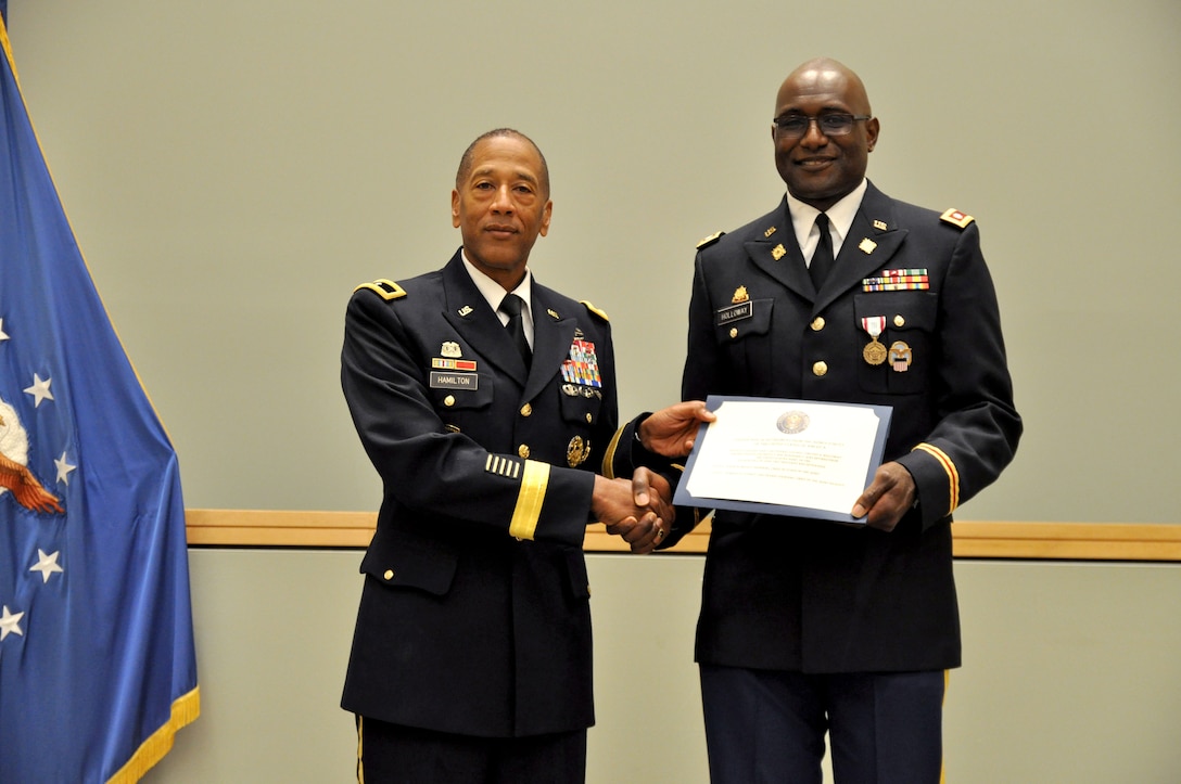 DLA Troop Support Commander Army Brig. Gen. Charles Hamilton, left, presents Army Lt. Col. Timothy N. Holloway with a certificate of appreciation during a retirement ceremony in Holloway’s honor June 4, 2017 in Philadelphia. Holloway retired after 32 years of active and reserve duty. 