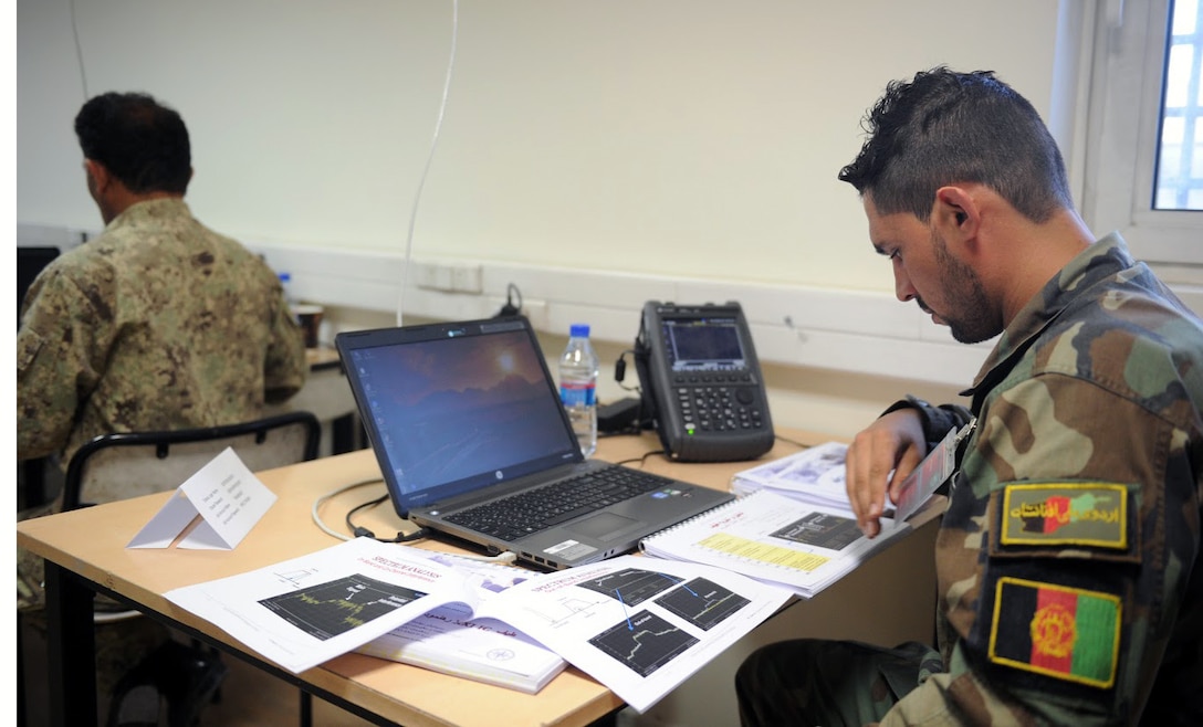 KABUL, Afghanistan (June 7, 2017) —1st Lt. Ahmad Shoaib Nabizada, honorary graduate, looks at his notes during the Spectrum Management class. The Afghan National Defense and Security Forces are to integrate its newest graduates in communication operations. These soldiers will be responsible for generating and ensuring accurate radio frequency signals, essential for combat operations, rescue missions and logistic support. (U.S. Navy photo by Lt. j.g. Egdanis Torres Sierra, Resolute Support Public Affairs – Afghanistan)