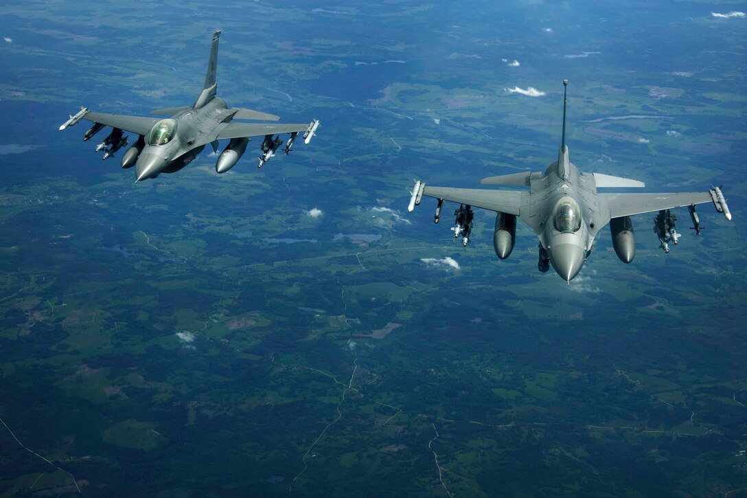 Two Air Force F-16 Fighting Falcon aircraft fly over Latvia, June 7, 2017, during Baltic Operations 2017. Air Force photo by Staff Sgt. Jonathan Snyder