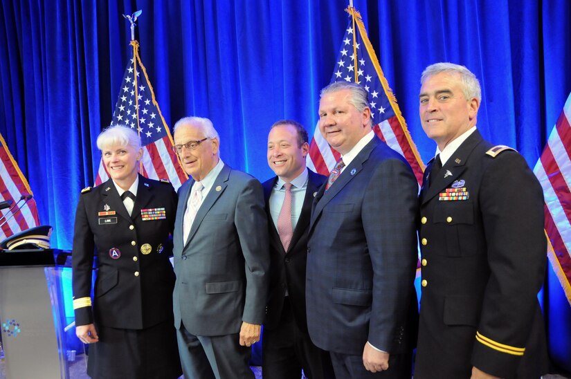 Maj. Gen. Mary Link, commanding general for Army Reserve Medical Command, stands next to Congressman Bill Pascrell from New Jersey’s 9th district; Congressman Josh Gottheimer, from New Jersey’s 5th district; Dr. Ihor Sawczuk, Hackensack University Medical Center President; and Col. Brad Wenstrup, commander of 7457th Medical Backfill Bn.

On June 5, 2017, Hackensack University Medical Center and the U.S. Army Reserve announced the formation of Operation Hackensack S.M.A.R.T. (Strategic Medical Asset Readiness Training), an innovative, first-of-its-kind partnership which focuses on high-quality, individualized specialty medical training for service members to improve their knowledge, skillsets and increase soldier readiness.  Soldiers will partner with their civilian counterparts at Hackensack University Medical Center for 14 days of immersion training utilizing cutting-edge technology, at no additional cost to the government. This innovative relationship will contribute to superior readiness and in-depth training within the medical ranks. It will also provide critical knowledge sharing between military and civilian medical professionals about best practices, techniques and procedures to ensure military service members are trained to use the most current technology in today’s rapidly changing health care landscape.