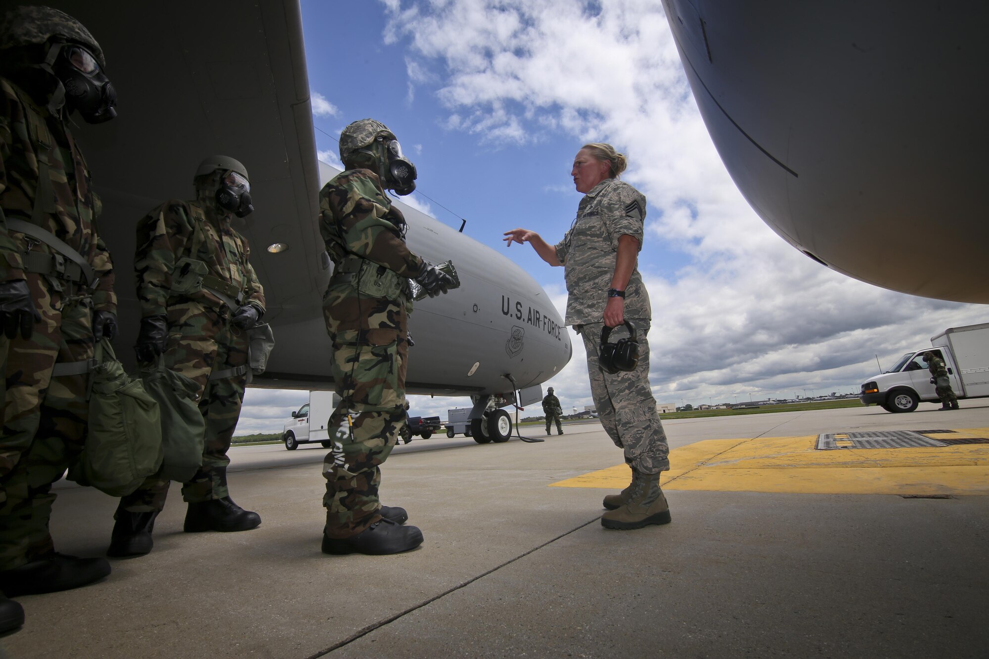 U.S. Air Force Chief Master Sgt. Michele Evans, right, briefs 108th Wing maintenance airmen on aircraft decontamination procedures during an exercise at Joint Base McGuire-Dix-Lakehurst, N.J., June 7, 2017. (U.S. Air National Guard photo by Master Sgt. Matt Hecht/Released)