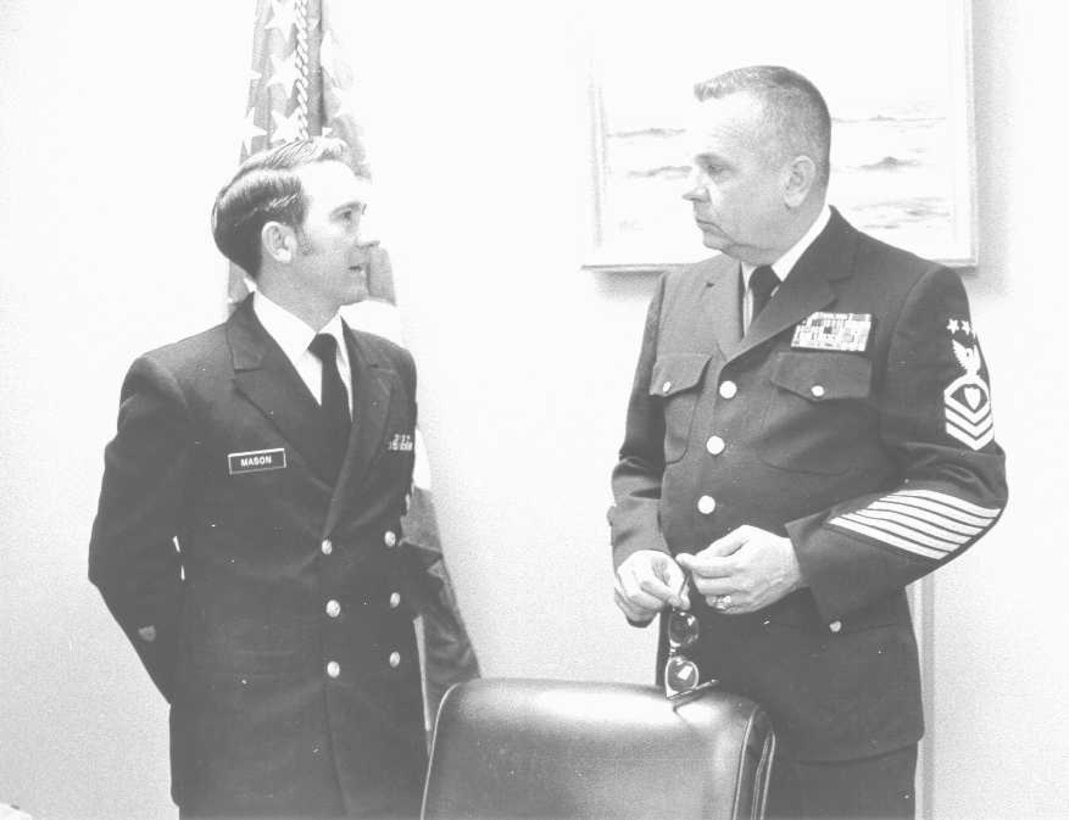 YNCS Earl C. Mason (left) in the then-current double breasted jacket.  Next to him on the right is the MCPOCG (BMCM) Charles L. Calhoun in the "new" Bender Blues-type uniform.  

 Photo date: 14 January 1972; photographer: PHC J. Valesques.