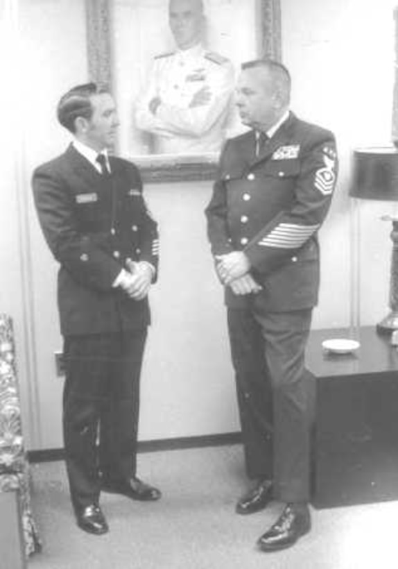 YNCS Earl C. Mason (left) in the then-current double breasted jacket.  Next to him on the right is the MCPOCG (BMCM) Charles L. Calhoun in the "new" Bender Blues-type uniform.  

 Photo date: 14 January 1972; photographer: PHC J. Valesques.