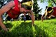 Master Sgt. Jennifer Cooley, left, and Staff Sgt. Meagan Hasty, both with the 39th Aerial Port Squadron, perform push-ups during the fifth Annual First Sergeant’s Fitness Challenge at Peterson Air Force Base, June 4, 2017. (U.S. Air Force photo/Staff Sgt. Frank Casciotta)