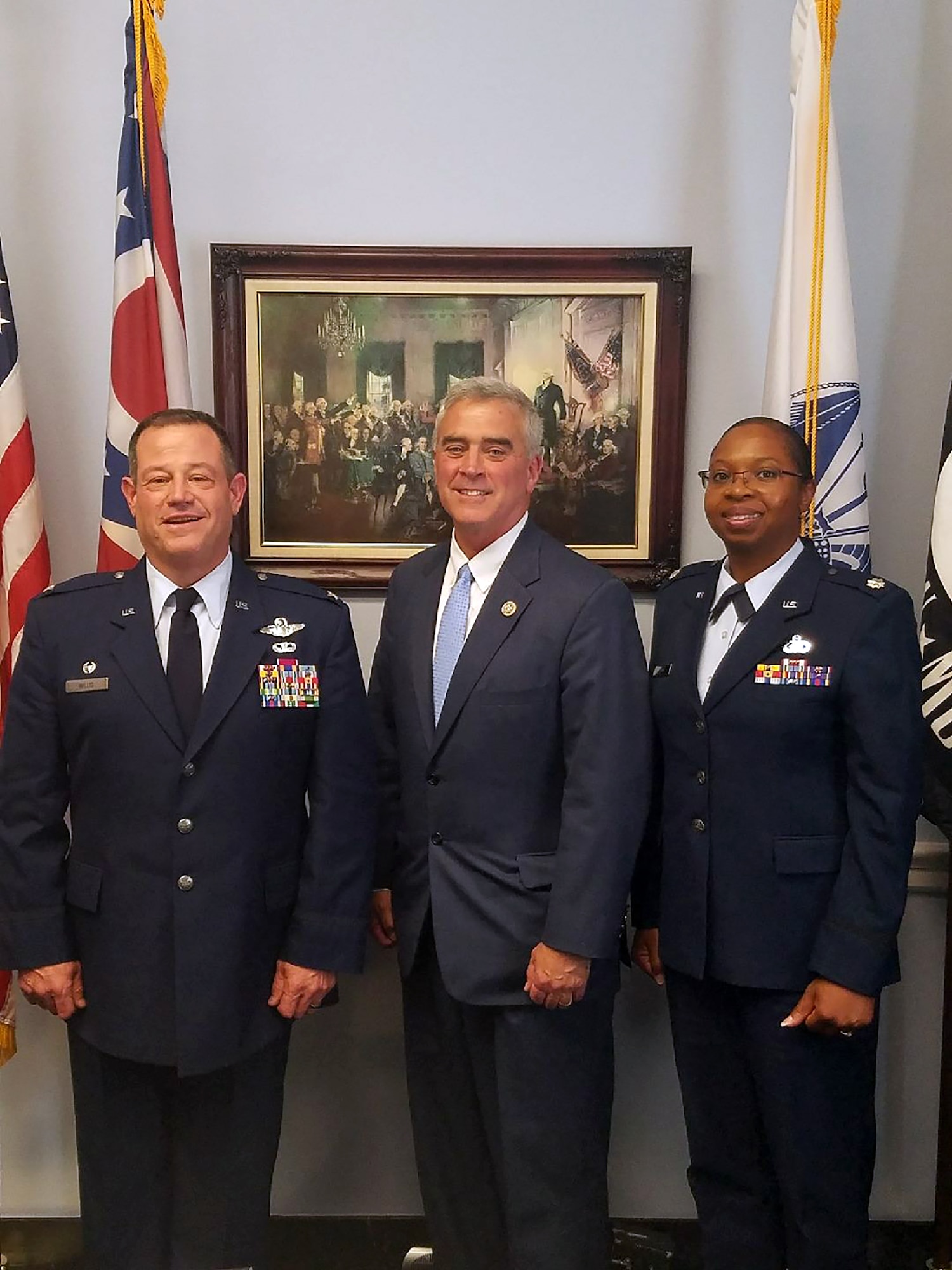 Col. Adam Willis, 445th Airlift Wing commander, and Lt. Col. Cynthia Harris, 445th AW chief of public affairs, visit with Congressman Brad Wenstrup, the Ohio 2nd district representative to the United States Congress, during a visit to Capitol Hill June 7, 2017. The visit gave Col. Willis the opportunity to meet with various Ohio congressional representatives and discuss issues affecting the wing. (Courtesy photo)