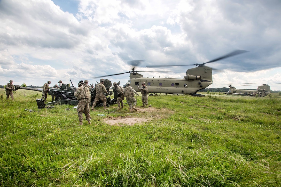 Solders move an M777A2 Howitzer during air assault training, part of Saber Strike 2017, at Bemowo Piskie Training Area near Orzysz, Poland, June 7, 2017. Army photo by Spc. Stefan English