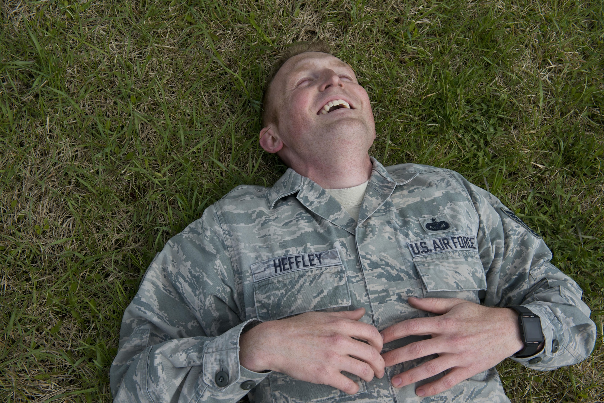 Tech. Sgt. Joshua Hefley, 673d Security Forces Squadron, Falcon Flight sergeant rests on the ground after sprinting a half-mile to warm up for training May 25, 2017, at the Elmendorf Fitness Center. For 30 days, Hefley and five others trained to prepare for the 2017 Pacific Air Forces Advanced Combat Skills Assessment. 