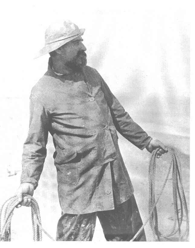 "Storm suit." no date.  Keeper Benjamin Cameron of the USLSS Station Kenosha, Wisconsin.  This is a photo taken by L. M. Thiers and is entitled "Throwing the Life Line."  
Published in the 31 March 1902 Milwaukee Sentinal.   