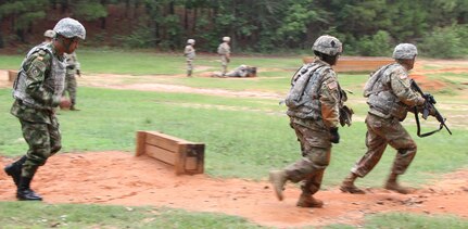 Colombian Sgt. Maj. Carlos Antonio Casio (left) gives chase during a buddy team live fire movement drill May 24 at Fort Jackson, S.C.. The teams performing the exercise were drill sergeant cadets graduating from the academy June 7. 
