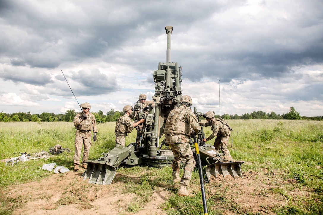 Solders prepare to load a round into an M777A2 Howitzer during exercise Saber Strike 2017, at Bemowo Piskie Training Area near Orzysz, Poland, June 7, 2017. Army photo by Spc. Stefan English