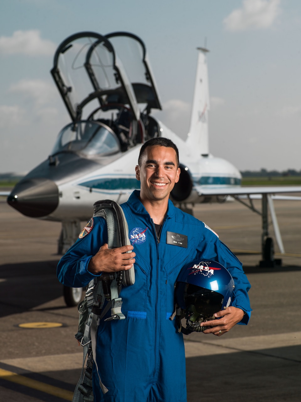 Air Force Lt. Col. Raja Chari stands in front of an NASA T-38 Talon supersonic trainer aircraft at Ellington Field in Houston, Texas, June 6, 2017. Chari has been selected to join the 2017 NASA Astronaut Candidate Class. NASA photo by Robert Markowitz
