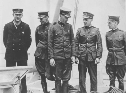 The crew of the NC-4, in Lisbon (Left to Right): Chief Machinist's Mate Eugene S. Rhoads, USN; LT James L. Breese, USN; LTJG Walter Hinton, USN; LT Elmer Stone, USCG; LCDR A.C. Read, Commanding Officer, NC-4.  Missing from photo is ENS Herbert C. Rodd, USN.