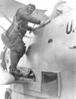Elmer Stone climbing into the cockpit of Coast Guard Grumman JF-2 V167