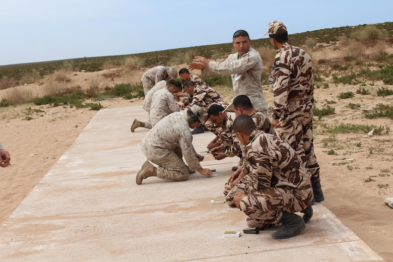 TIFNIT, Morocco - U.S. Marines instruct their counterparts from the Royal Moroccan Armed Forces on proper weapons techniques during Exercise African Lion 2017. African Lion is a combined, multilateral exercise designed to improve interoperability and mutual understanding of each nation’s tactics, techniques and procedures while demonstrating the strong bond between the nation’s militaries. (Photo by Thomas Flatley)