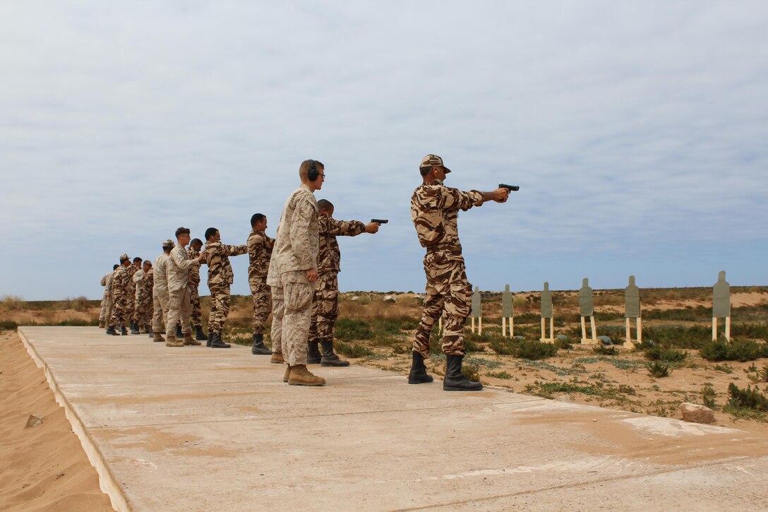 TIFNIT, Morocco - U.S. Marines instruct their counterparts from the Royal Moroccan Armed Forces on proper weapons techniques during Exercise African Lion 2017. African Lion is a combined, multilateral exercise designed to improve interoperability and mutual understanding of each nation’s tactics, techniques and procedures while demonstrating the strong bond between the nation’s militaries. (Photo by Thomas Flatley)