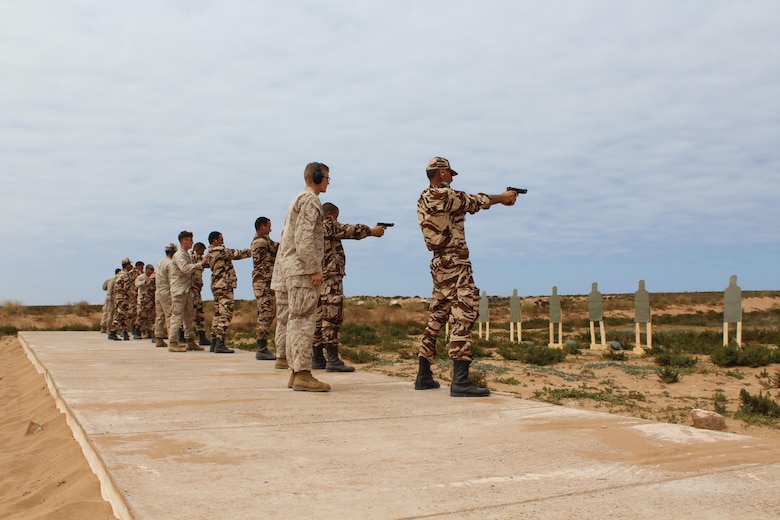 TIFNIT, Morocco - U.S. Marines instruct their counterparts from the Royal Moroccan Armed Forces on proper weapons techniques during Exercise African Lion 2017. African Lion is a combined, multilateral exercise designed to improve interoperability and mutual understanding of each nation’s tactics, techniques and procedures while demonstrating the strong bond between the nation’s militaries. (Photo by Thomas Flatley)