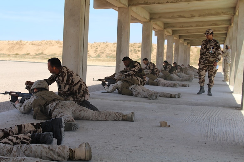 TIFNIT, Morocco - Royal Moroccan Armed Forces personnel instruct their U.S. Marine counterparts on proper weapons techniques during Exercise African Lion 2017. African Lion is a combined, multilateral exercise designed to improve interoperability and mutual understanding of each nation’s tactics, techniques and procedures while demonstrating the strong bond between the nation’s militaries. (Photo by Thomas Flatley)