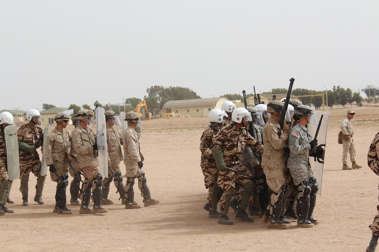 TIFNIT, Morocco - Multinational platoons consisting of personnel from the Moroccan Armed Forces, U.S. Marines and U.S. Army practice riot-control techniques at the training area in Tifnit, Morocco during Exercise African Lion 2017. African Lion is a combined, multilateral exercise designed to improve interoperability and mutual understanding of each nation’s tactics, techniques and procedures while demonstrating the strong bond between the nation’s militaries. (Photo by Thomas Flatley)