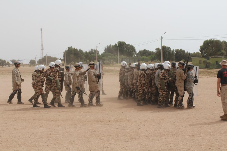 TIFNIT, Morocco - Multinational platoons consisting of personnel from the Moroccan Armed Forces, U.S. Marines and U.S. Army practice riot-control techniques at the training area in Tifnit, Morocco during Exercise African Lion 2017. African Lion is a combined, multilateral exercise designed to improve interoperability and mutual understanding of each nation’s tactics, techniques and procedures while demonstrating the strong bond between the nation’s militaries. (Photo by Thomas Flatley)