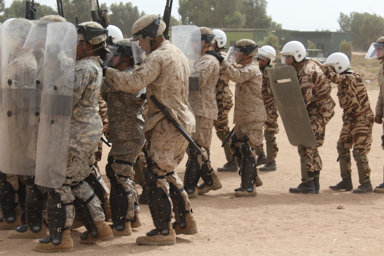 TIFNIT, Morocco - Multinational platoons consisting of personnel from the Moroccan Armed Forces, U.S. Marines and U.S. Army practice riot-control techniques at the training area in Tifnit, Morocco during Exercise African Lion 2017. African Lion is a combined, multilateral exercise designed to improve interoperability and mutual understanding of each nation’s tactics, techniques and procedures while demonstrating the strong bond between the nation’s militaries. (Photo by Thomas Flatley)