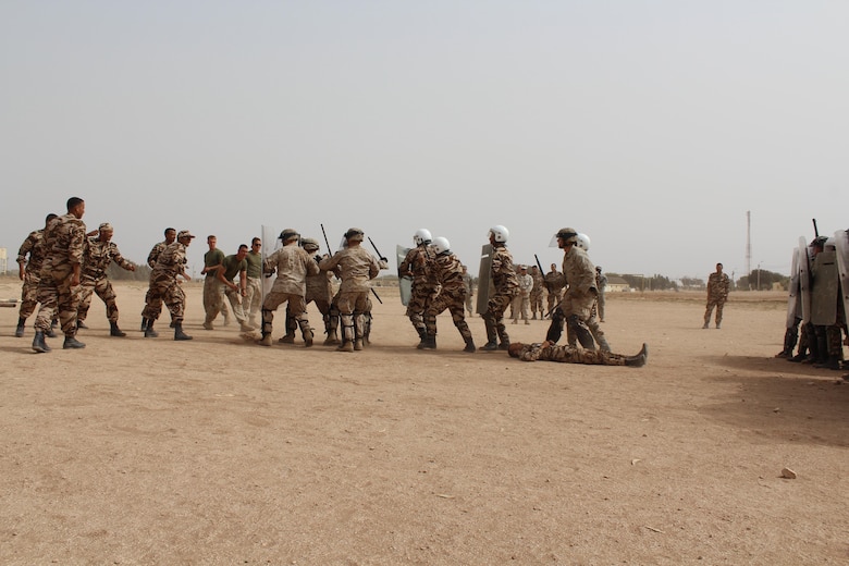 TIFNIT, Morocco - Multinational platoons consisting of personnel from the Moroccan Armed Forces, U.S. Marines and U.S. Army practice riot-control techniques at the training area in Tifnit, Morocco during Exercise African Lion 2017. African Lion is a combined, multilateral exercise designed to improve interoperability and mutual understanding of each nation’s tactics, techniques and procedures while demonstrating the strong bond between the nation’s militaries. (Photo by Thomas Flatley)