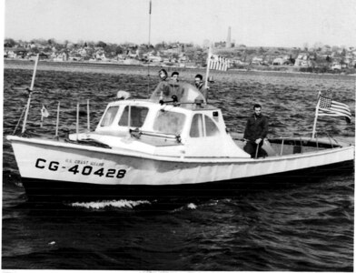 CG-40428: next to the Coast Guard ensign is BM3 (later BMCM) Charles "Mac" McGowan, alongside him is EN2 Reagan, third crewman is unknown.