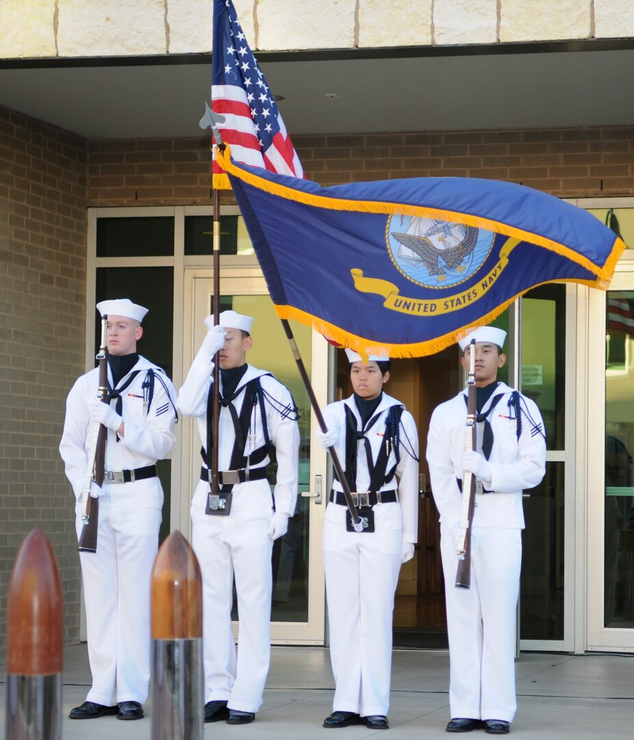 The Basic Medical Technician and Corpsman Program Color Guard presents the colors during the singing of the national anthem at a commemoration of the Battle of Midway 75th Anniversary at the Medical Education and Training Campus June 6 at Joint Base San Antonio-Fort Sam Houston. The ceremony consisted of a guest speaker, ceremonial laying of the wreath and singing of the Navy Hymn.