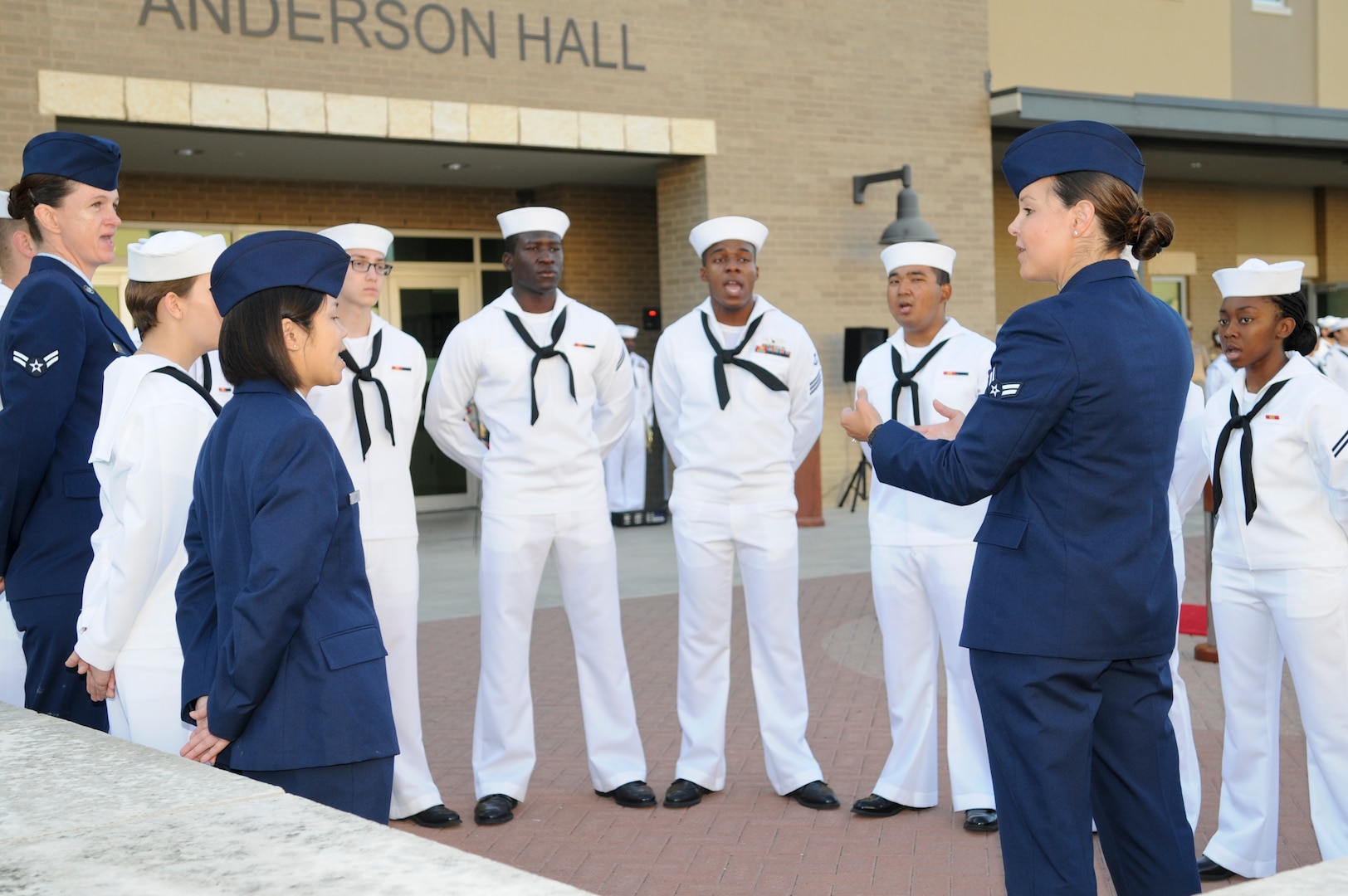 Sailors and Airmen in the Basic Medical Technician and Corpsman Program (BMTCP) Choir sing the Navy Hymn during a commemoration of the 75th Anniversary of the Battle of Midway at the Medical Education and Training Campus June 6 at Joint Base San Antonio-Fort Sam Houston. Navy Medicine Training Support Center hosted the ceremony with hundreds of staff and students in attendance.