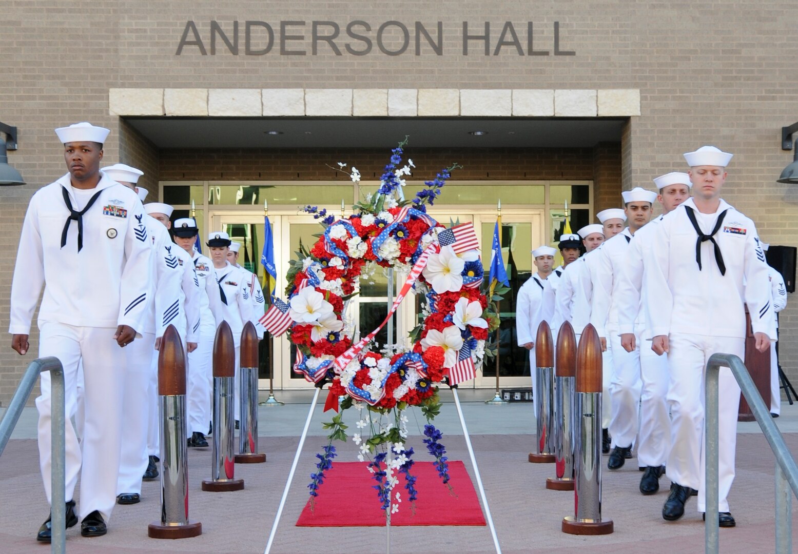 Sailors from Navy Medicine Training Support Center, or NMTSC, post as “side boys” during a ceremony to commemorate the Battle of Midway outside of the hospital corpsman schoolhouse June 6 at Joint Base San Antonio-Fort Sam Houston. NMTSC conducted the ceremony and wreath laying to commemorate the 74th anniversary of the decisive battle and honor those who paid the ultimate sacrifice.