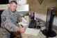 Working from his home in Layton, Utah, Master Sgt. and author Brian Sharkey, proofreads a copy of his latest book, “Nocturnal Awakenings,” June 7. In his personal time, Sharkey enjoys writing fictional literature, specifically horror stories, and is expecting the release of his second published novel this week. (U.S. Air Force photo by Todd Cromar) 