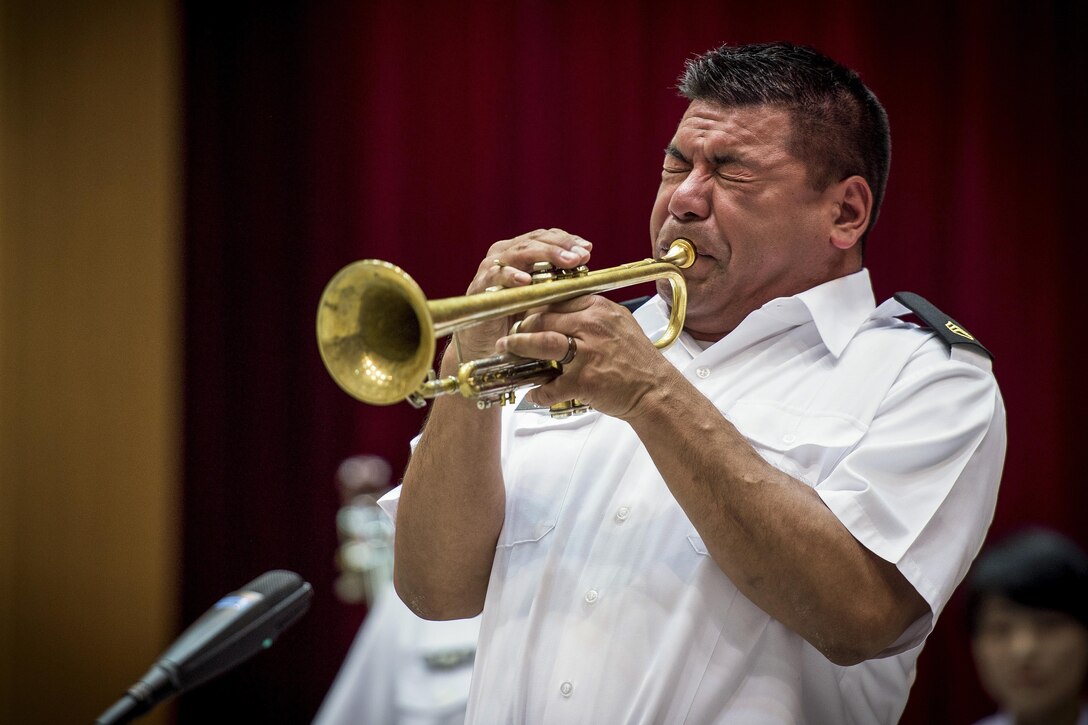 Army Staff Sgt. Joel Heredia performs a trumpet solo during a joint big band concert at the Japanese Ministry of Defense in Tokyo, June 7, 2017. U.S. and Japanese military bands performed together at the event, highlighting the strong alliance and friendship shared between the two nations’ forces. Air Force photo by Airman 1st Class Donald Hudson