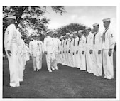 Air Station Barbers Point, Hawaii
Original photo caption: "Rea Admiral S. H. Evans, Commander of the 14th Coast Guard District, inspects personnel attached to the Coast Guard Air Detachment, Barbers Point, on Thursday November 5, 1959.  Accompanying Rear Admiral Evans in the inspection party is Lieutenant Commander A. H. Siemens, Commander W. C. Mitchell, Rear Admiral Evans, and the Commanding Officer of the Coast Guard Air Detachment, Commander W. E. Chapline, Jr."; Photo No. 14CGD-11085901; photographer unknown.