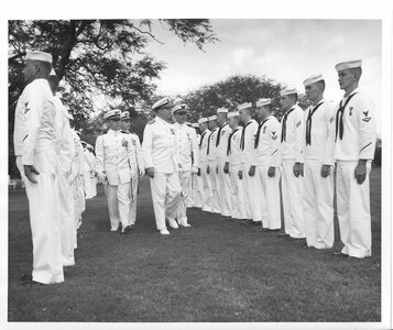 Air Station Barbers Point, Hawaii
Original photo caption: "Rea Admiral S. H. Evans, Commander of the 14th Coast Guard District, inspects personnel attached to the Coast Guard Air Detachment, Barbers Point, on Thursday November 5, 1959.  Accompanying Rear Admiral Evans in the inspection party is Lieutenant Commander A. H. Siemens, Commander W. C. Mitchell, Rear Admiral Evans, and the Commanding Officer of the Coast Guard Air Detachment, Commander W. E. Chapline, Jr."; Photo No. 14CGD-11085901; photographer unknown.