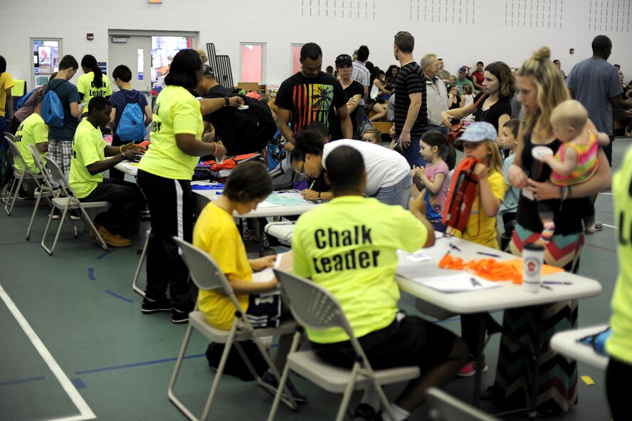 Minot Air Force Base families check in at the Operation Heroes event at Minot Air Force Base, N.D., June 3, 2017. Operation Heroes gives families the experience of what military members do when they deploy. (U.S. Air Force Photo by Staff Sgt. Chad Trujillo)