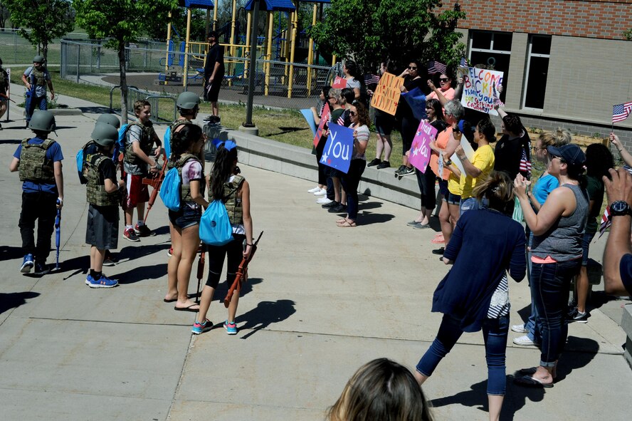 Operation Heroes participants are welcomed home from a simulated deployment at Minot Air Force Base, N.D., June 3, 2017. The event simulated for families several aspects of what military members go through when they deploy.(U.S. Air Force Photo by Staff Sgt. Chad Trujillo) 